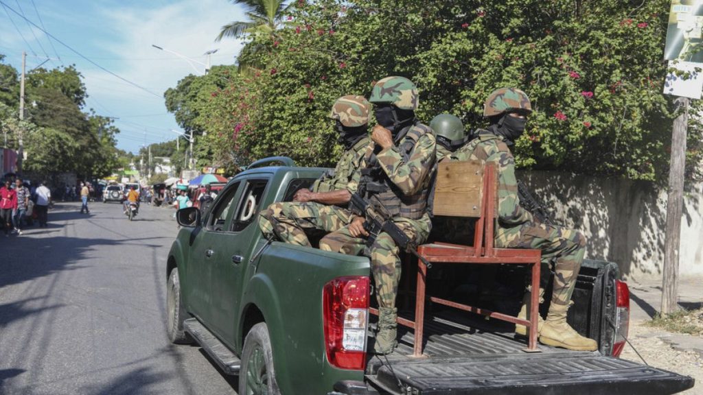 FILE: Soldiers patrol a street in Port-au-Prince, Haiti, Monday, Dec. 2, 2024