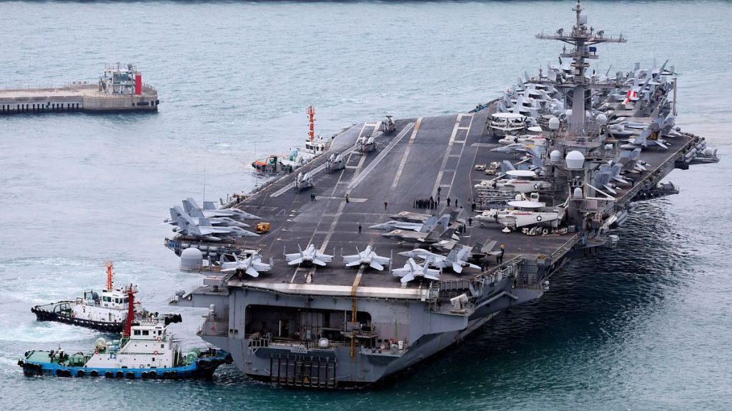 The USS Carl Vinson aircraft carrier is escorted into a navy port in Busan, South Korea, Sunday, 2 March 2025.