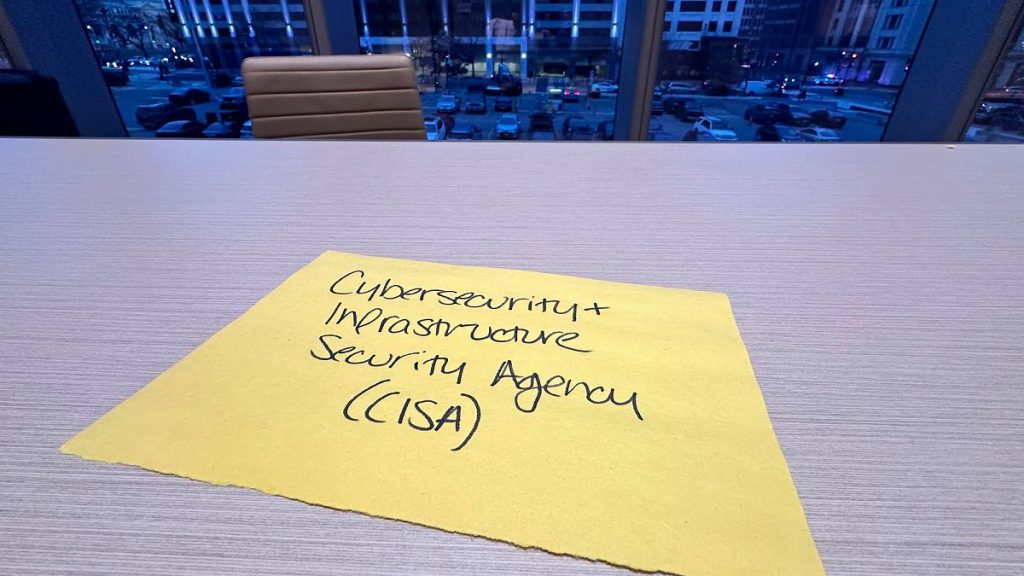 A spot that had been reserved for a representative of the Cybersecurity and Infrastructure Security Agency sits vacant at a meeting in February 2025.
