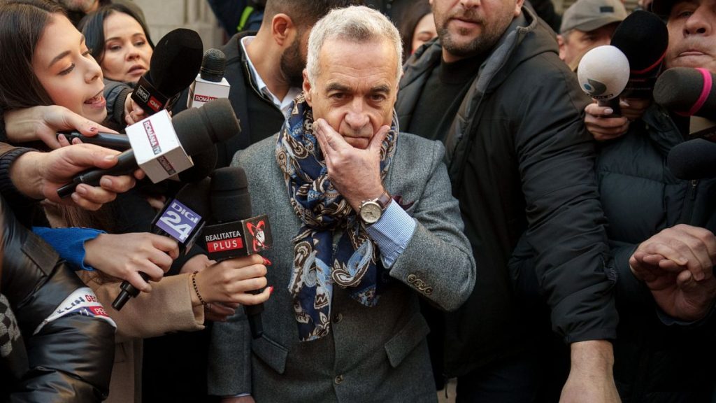 FILE: Calin Georgescu gestures as he leaves a district court in Bucharest, 5 March 2025