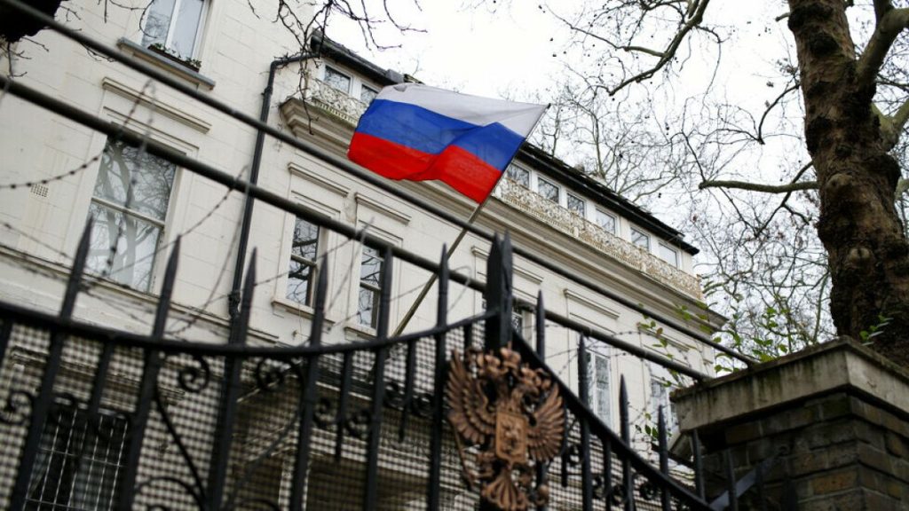 FILE: A Russian flag flies outside the Consular Section of the Russian Embassy in London, Tuesday, Feb. 22, 2022.