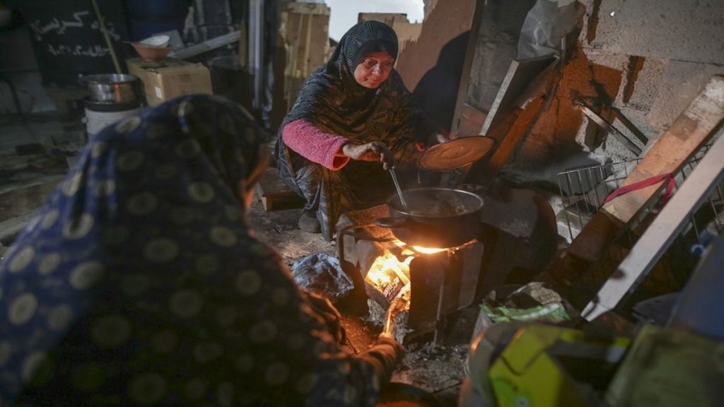 Fatima Al-Absi prepares food for her family