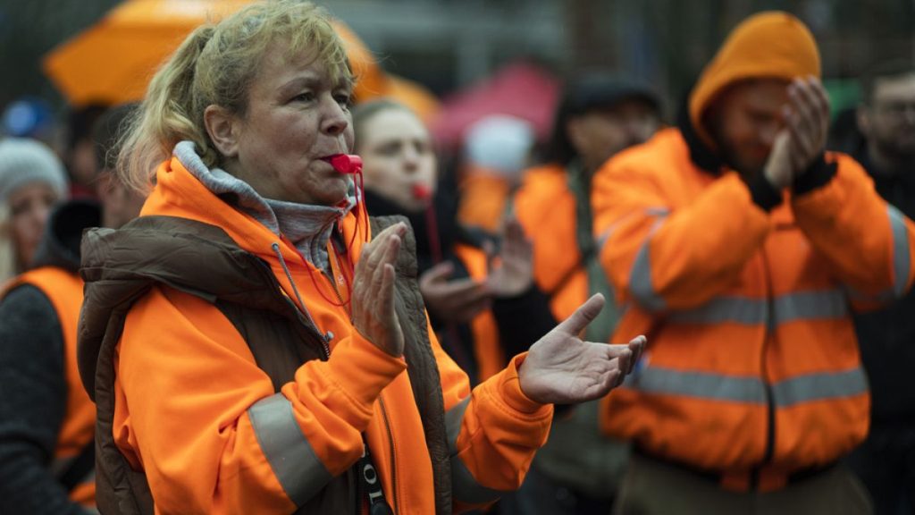 Berlin public services employees attend a demonstration as part of a warning strike by the Ver.di union in Berlin, Germany, Friday, March 24, 2023.