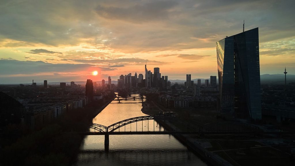 Sun sets behind the European Central Bank and the city in Frankfurt, Germany. 24 March 2025.