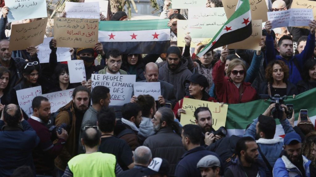 Activists protest against the recent wave of violence and sectarian attacks in Syria
