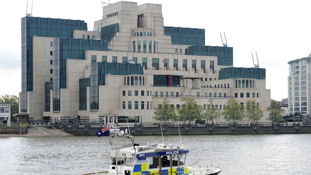 A police boat is pictured on the River Thames near the MI6 building in London.