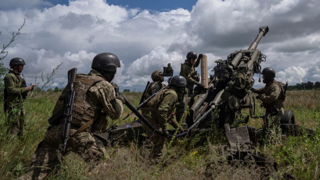 FILE - Ukrainian servicemen prepare to fire at Russian positions from a U.S.-supplied M777 howitzer in Kharkiv region, Ukraine, July 14, 2022.