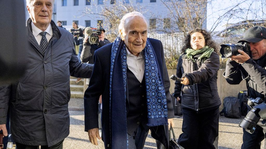 Ex-FIFA president Sepp Blatter, center, arrives at special appeals court in Muttenz, Switzerland, for his retrial on fraud, forgery and misappropriation charges, 3 March 2025.