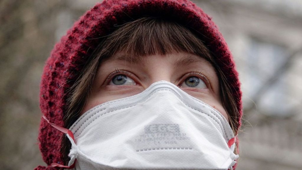 A woman wearing a gas mask takes part in a protest against air pollution, in Sarajevo, Bosnia, 20 January 2020.