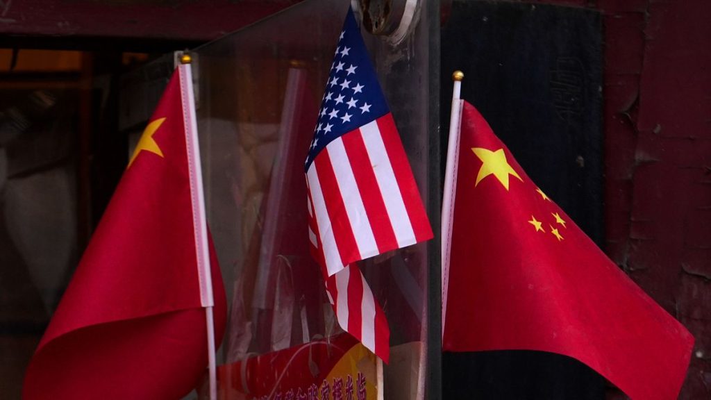 China and US national flags are seen on display outside a souvenir shop in Beijing, 31 January 2025