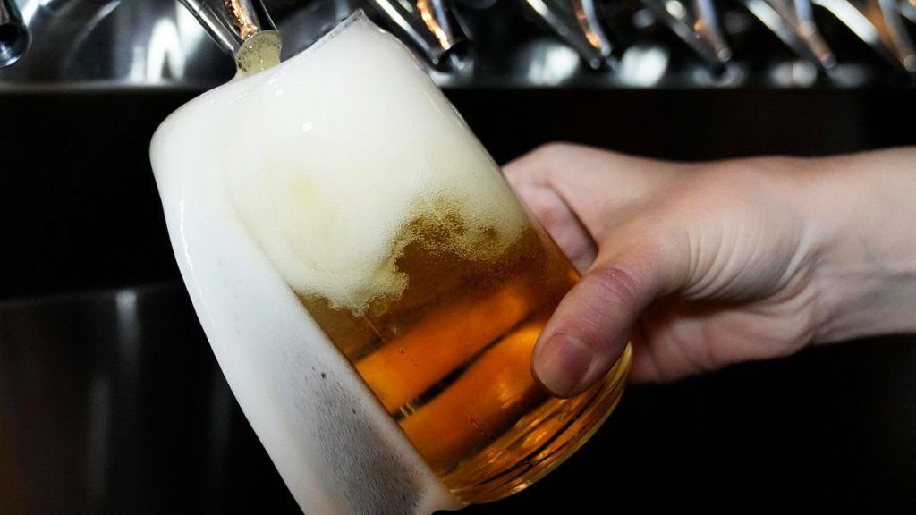A bartender pours a craft beer at the Liquid Love Brewing in Buffalo Grove, Ill. 9 Feb. 2022.