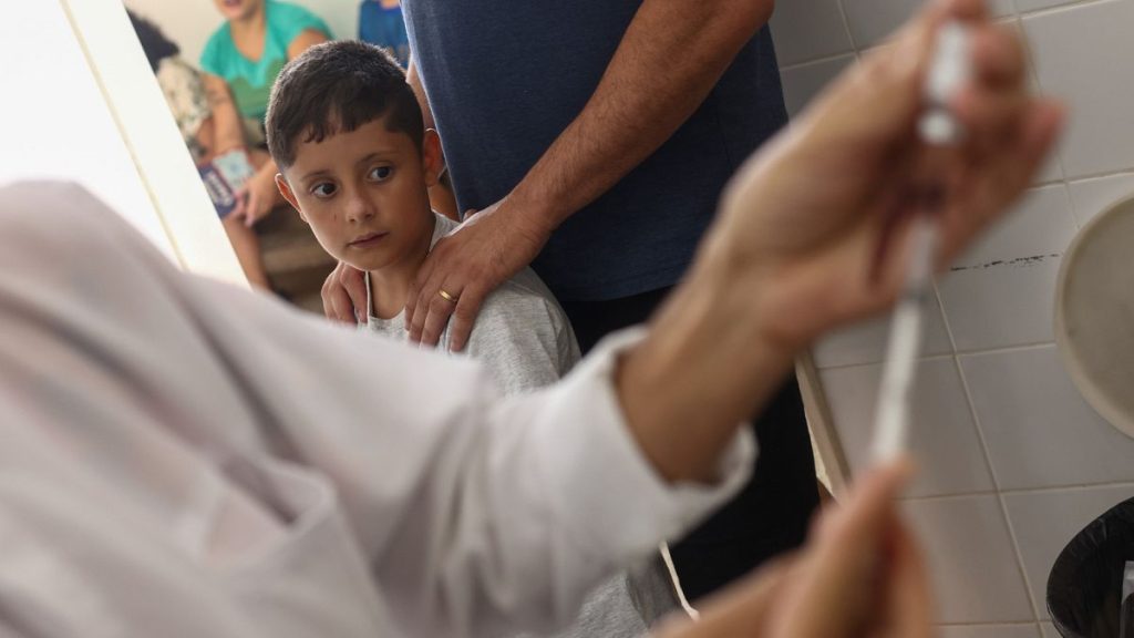 A dose of the dengue vaccine is prepared for youths at a health center in Brazil in February 2024.
