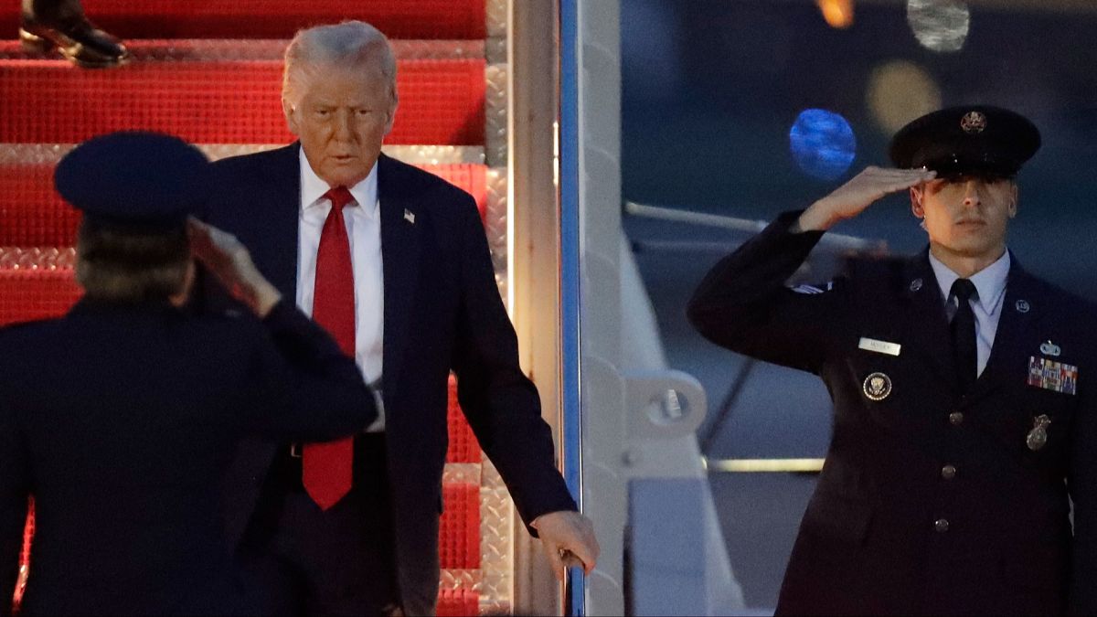 US President Donald Trump walks down the stairs of Air Force One upon his arrival at Joint Base Andrews, 30 March 2025
