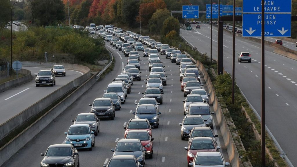 Parisian caught in traffic jam as they drive home.