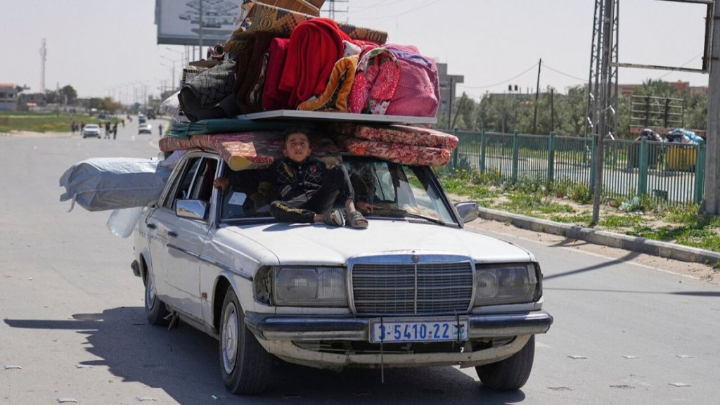 Displaced Palestinians, who flee from Rafah, arrive in Khan Younis, Gaza, on Monday, March 31, 2025, after the Israeli military issued sweeping evacuation orders.