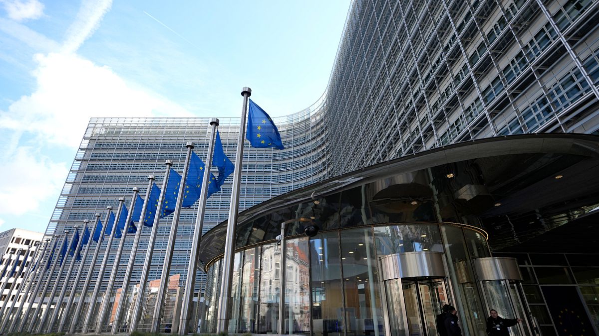 European Union flags fly outside the EU Commission building in Brussels, 25 March, 2024