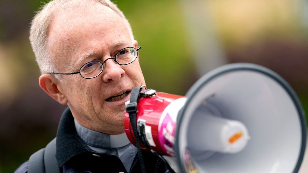 Priest Joerg Alt addresses supporters prior to the beginning of his trial at a court in Munich, Germany.