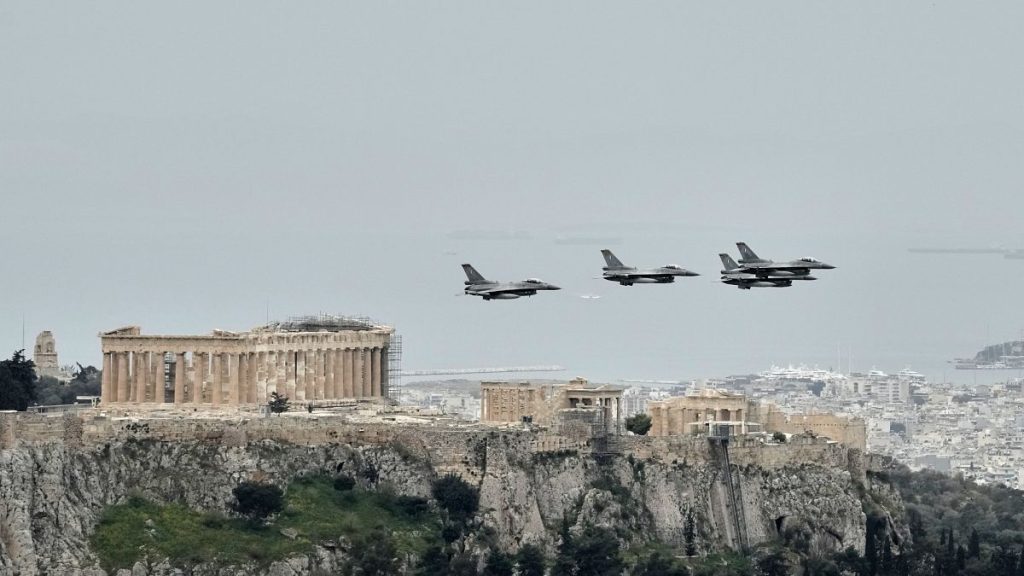 Greek F-16 fighter jets fly in front of the Acropolis during a military parade in Athens, 25 March, 2025