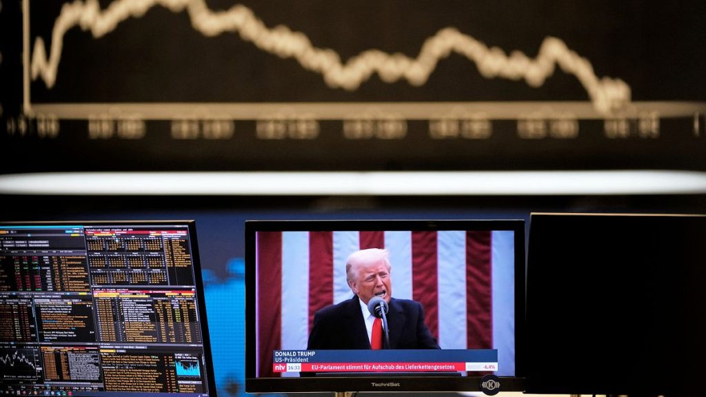 US President Donald Trump appears on a television screen at the stock market in Frankfurt, 3 April, 2025