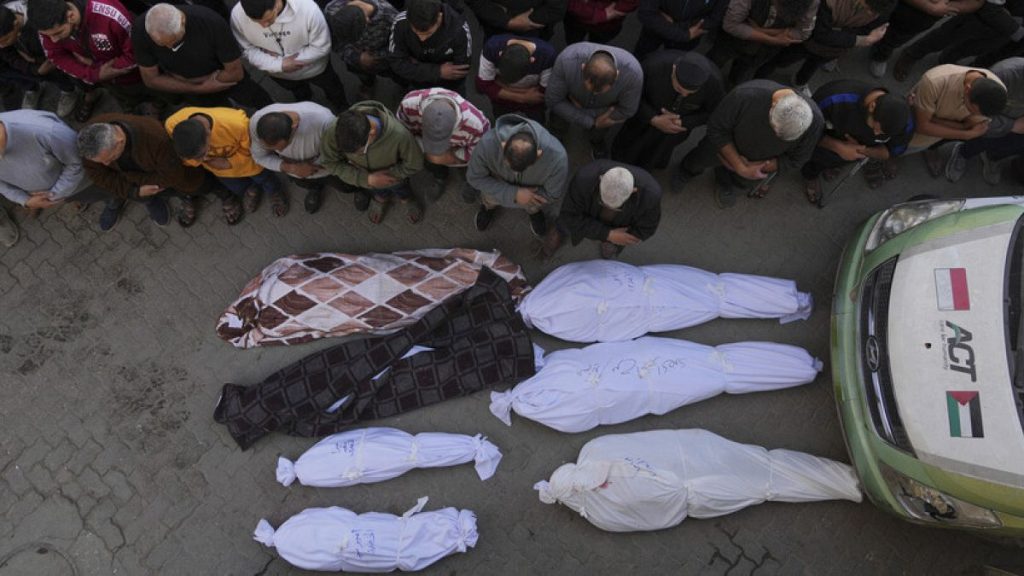 Palestinians pray over the bodies of their relatives, who were killed in an Israeli airstrike, at the Baptist Hospital in Gaza City, on Thursday, April 3, 2025