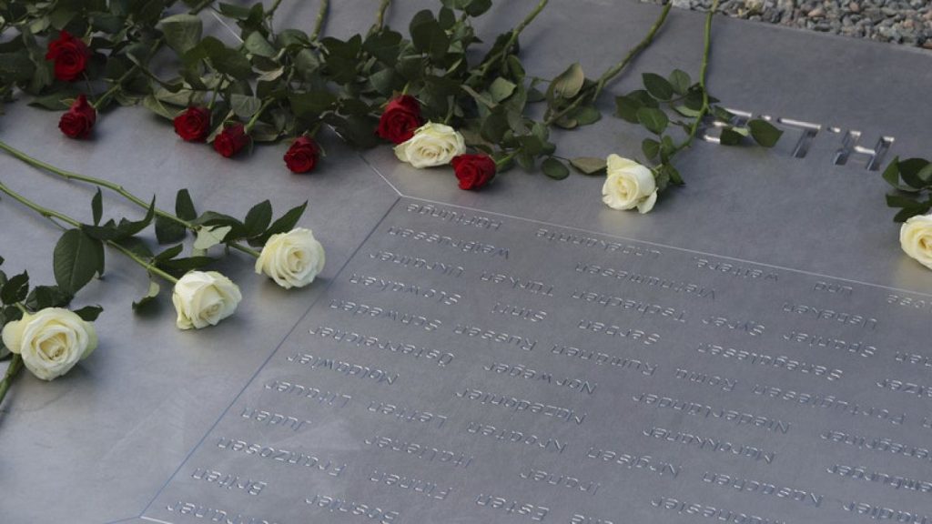 Flowers lie on a memorial plaque of the former Buchenwald concentration camp to mark the 80th anniversary of the liberation of the Buchenwald concentration camp, April 6, 2025