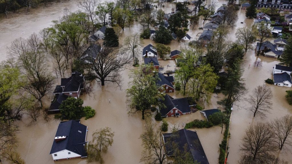 In an aerial view, a flooded neighborhood is seen on Sunday, April 6, 2025, in Frankfort, Kentucky