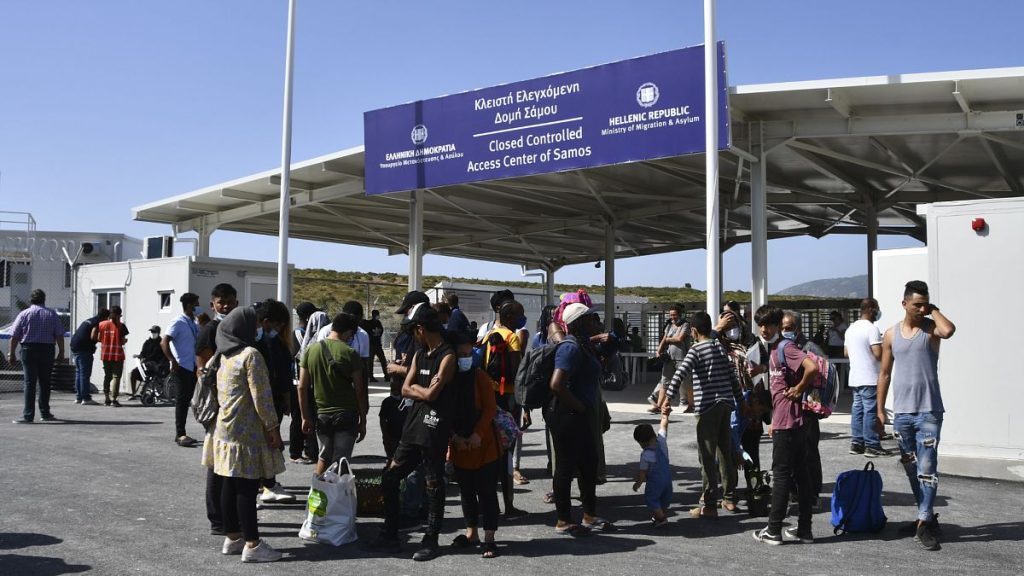 Migrants wait outside the new closed monitored facility in Zervou village on Samos, Greece, 20 September, 2021