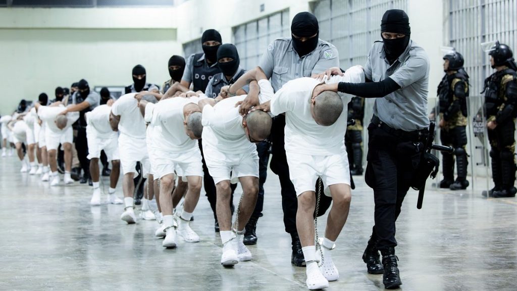 Prison guards transfer deportees from the US, alleged to be Venezuelan gang members, to the Terrorism Confinement Centre in Tecoluca, El Salvador, on 16 March, 2025.