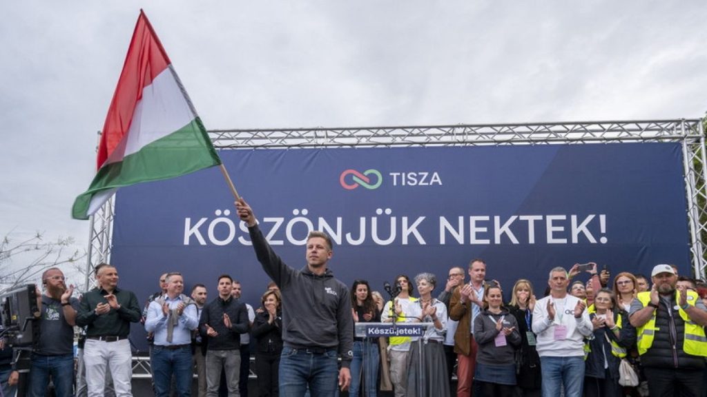 Leader of the Hungarian opposition Tisza Party Peter Magyar waves a Hungarian flag at a rally held in Budapest, Hungary, Sunday, April 13, 2025