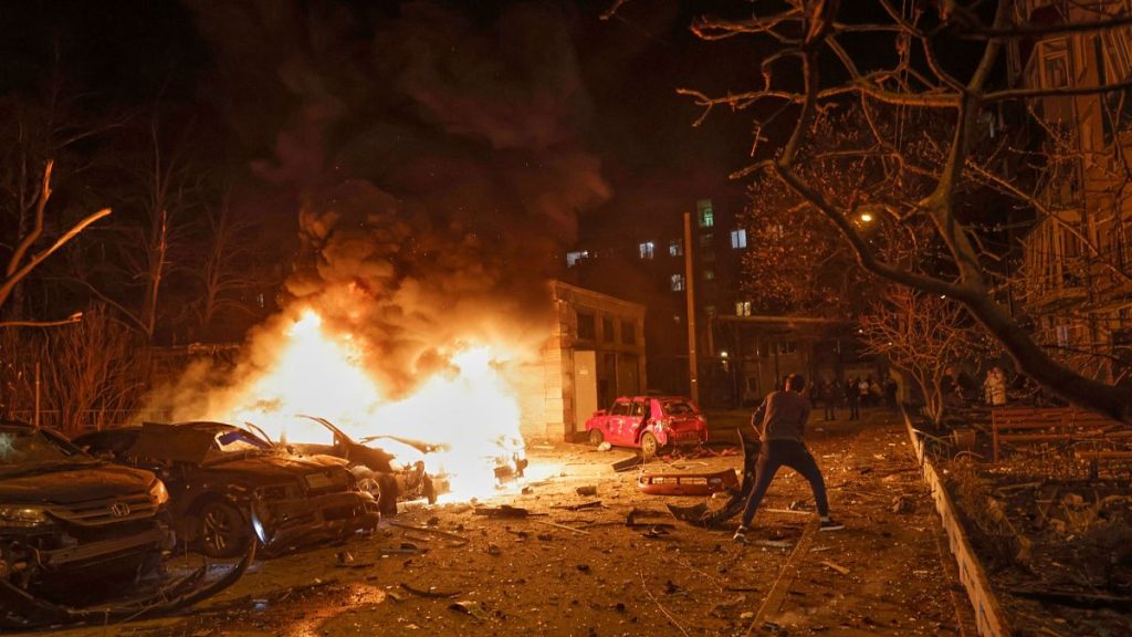 A resident responds to a fire following Russia