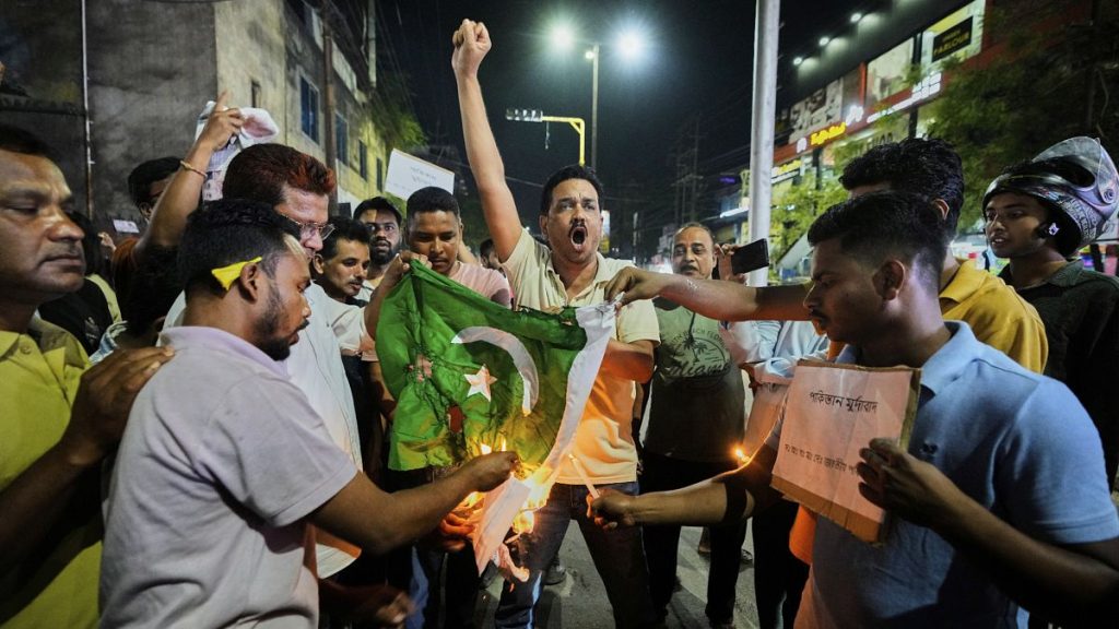 People burn a Pakistani flag in Guwahati in protest against the killing of tourists by militants in Kashmir, 23 April, 2025