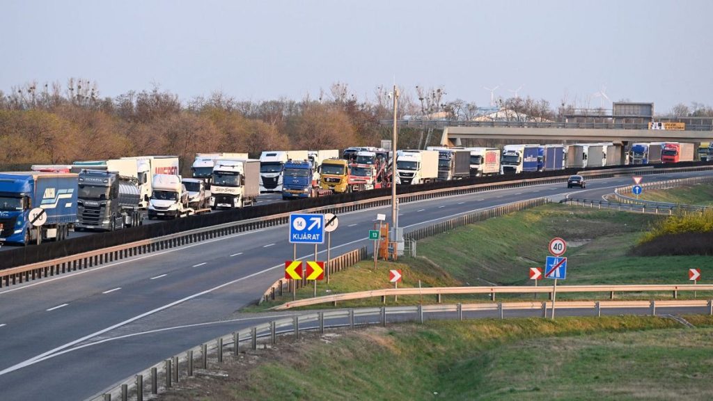 Trucks queue on the road leading to the border crossing between Hungary and Slovakia at Rajka, Hungary.