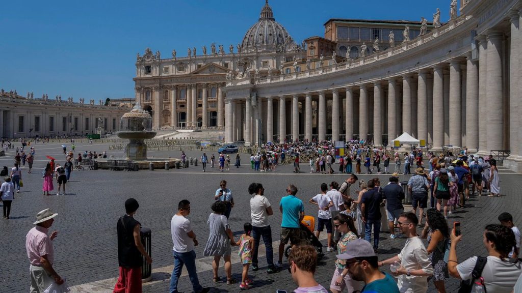 Tourists and faithful wander in St. Peter
