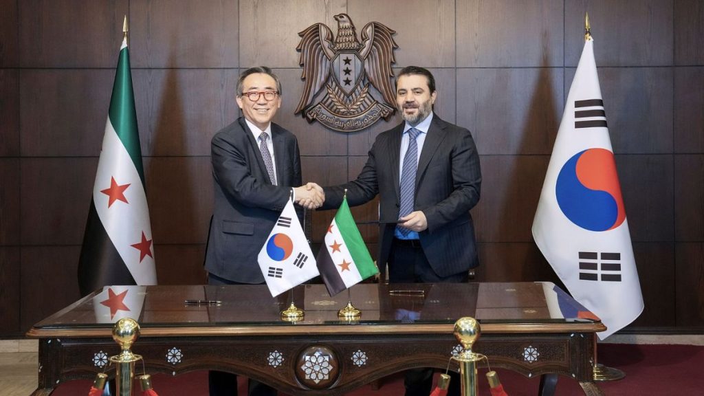 South Korean Foreign Minister Cho Tae-yul, left, shakes hands with Syrian Foreign Minister Asaad al-Shaibani after signing a joint statement, 10 April 2025.