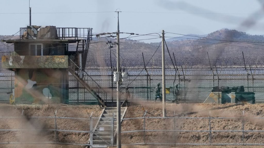 South Korean soldiers patrol the barbed-wire fence in Paju, South Korea, near the border with North Korea on 18 February, 2025.