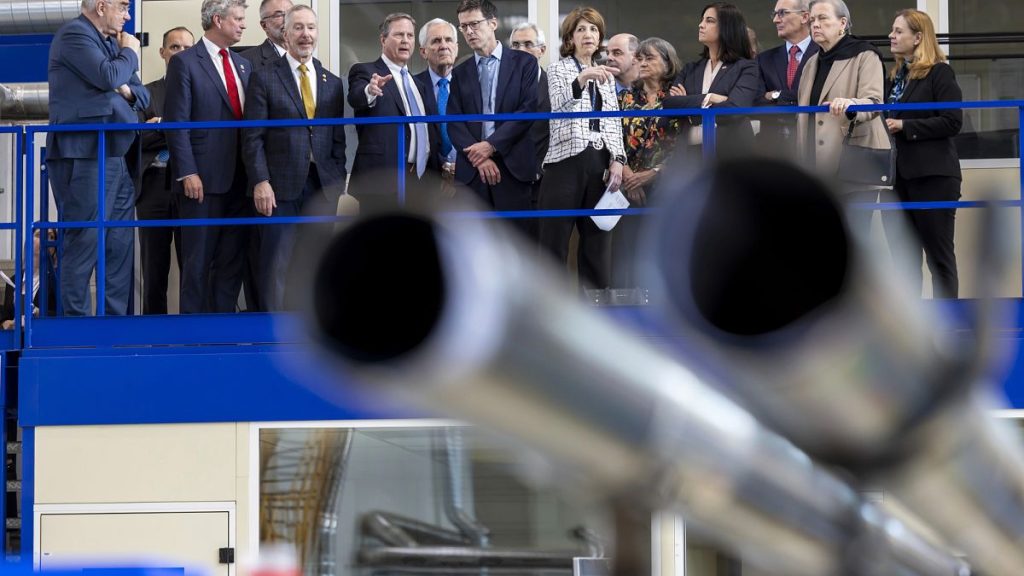 Mike Lamont, director for accelerators and technology, center left, and Fabiola Gianotti, center right, director general of CERN