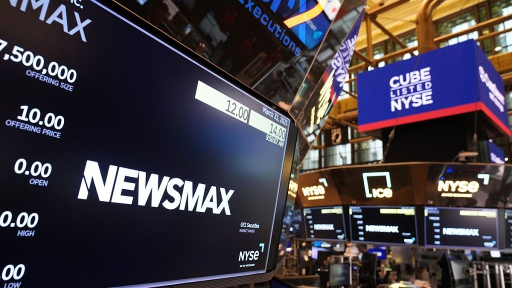 A display shows a Newsmax logo on the day of their IPO on the floor at the New York Stock Exchange in New York, Monday, March 31, 2025.