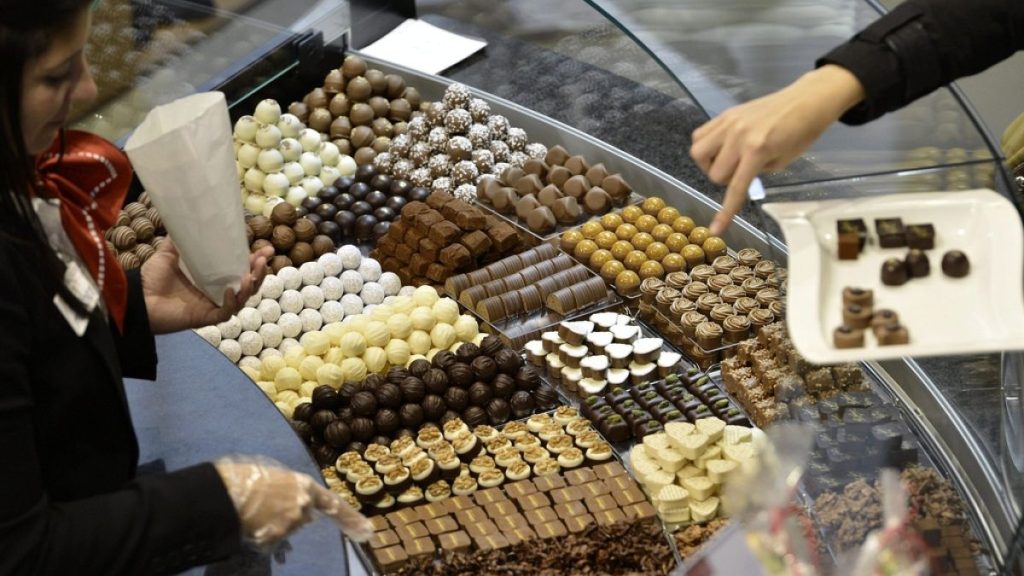 Visitors taste different sorts of chocolate, during the second International Salon des Chocolatiers et du Chocolat, on Oct. 27, 2012 in Geneva, Switzerland.