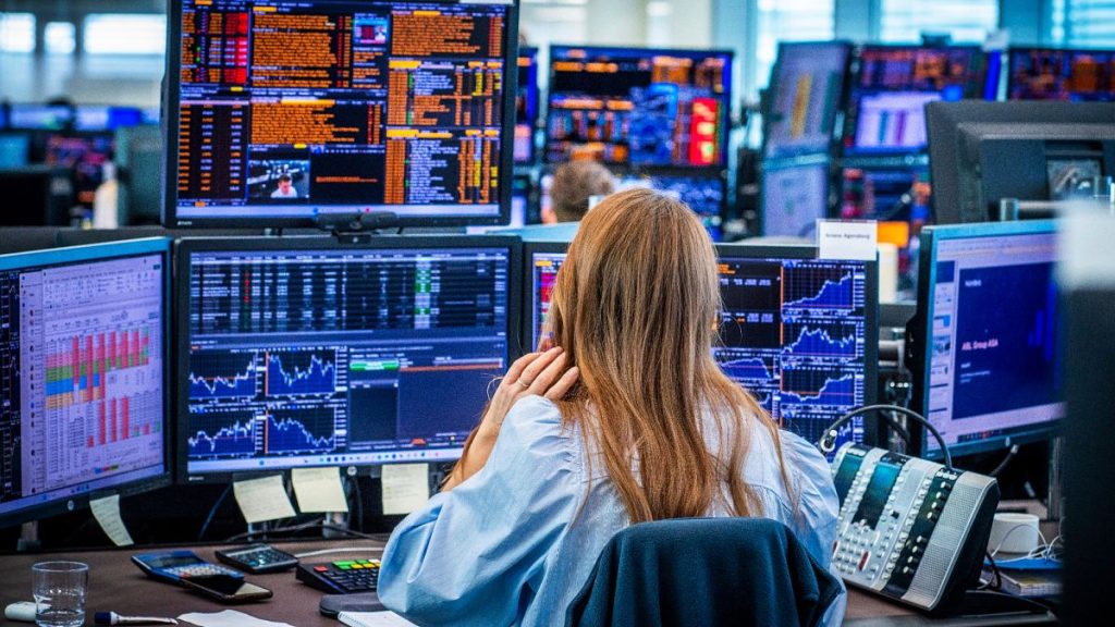 Employees in the trading room of Nordea Markets follow the stock market in Oslo, Norway, Monday, April 7, 2025.