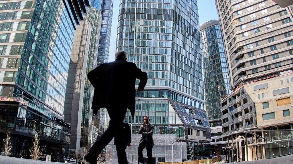 A man leaves a bank building in Frankfurt, Germany, Monday, March 31, 2025.