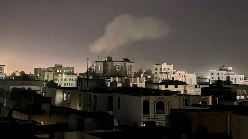 Smoke rises from a location reportedly struck by U.S. airstrikes in Sanaa, Yemen, Sunday, March 30, 2025.
