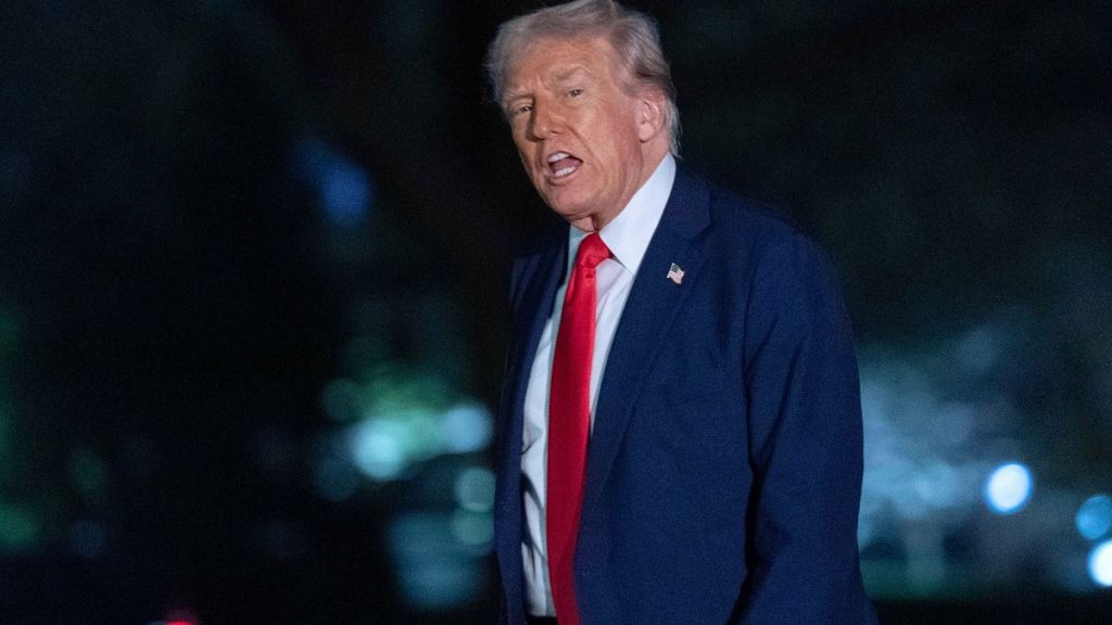 President Donald Trump talks to reporters as he walks on the South Lawn of the White House, in Washington, Sunday, March 30, 2025.