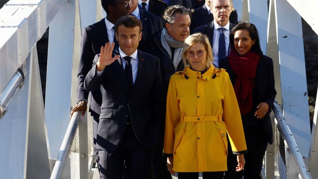 Emmanuel Macron walks with French Minister for Energy Transition Agnes Pannier-Runacher during a visit to the Saint-Nazaire offshore wind farm, September 2022.