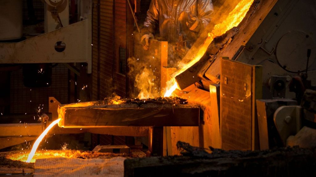 Molten steel being poured into a cast in a steel foundry