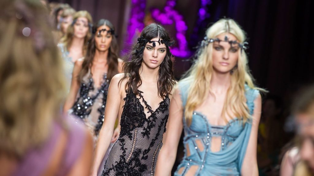 Kendall Jenner , centre, wears a creation for Italian fashion designer Donatella Versace
