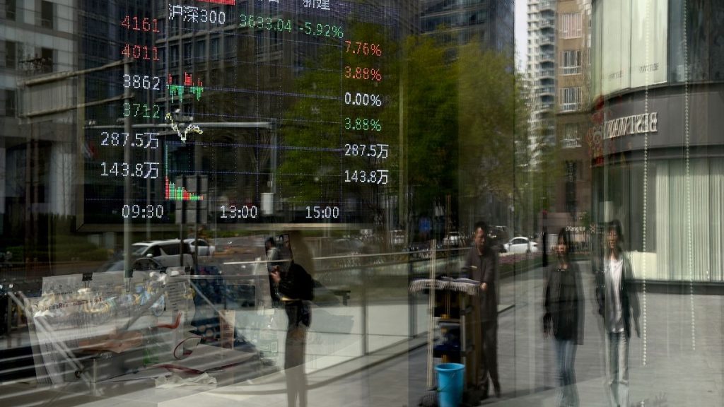 Pedestrians and office buildings are reflected on a brokerage house