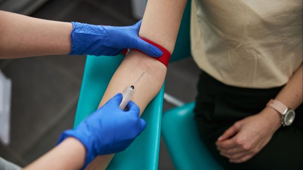 A patient has her blood drawn.