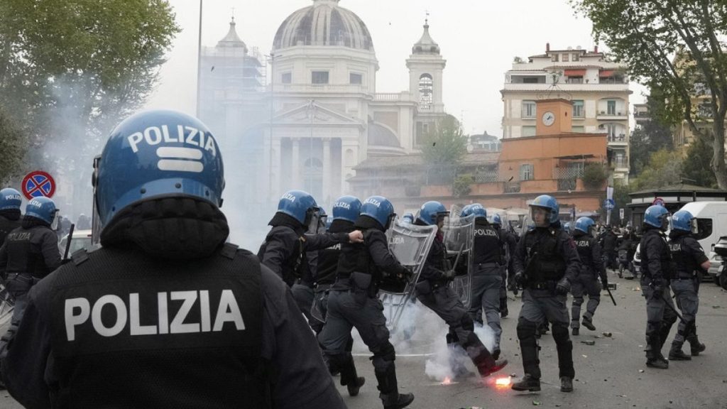Lazio fans clash with policemen in riot gear outside the Olympic Stadium prior to the start of the Italian Serie A soccer match between Lazio and Roma in Rome, April 13, 2025