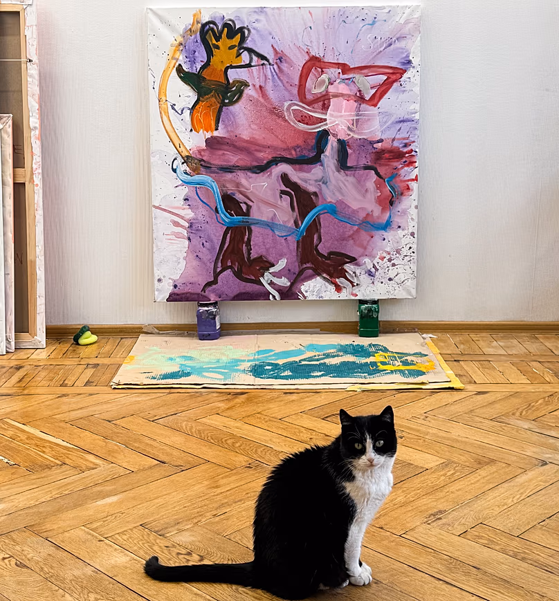 Vlad’s cat in front of one of his artworks