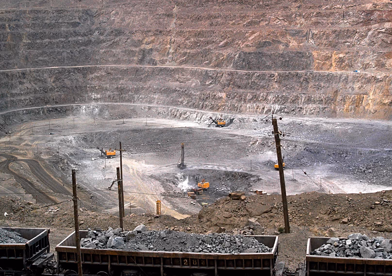 Workers use machinery to dig at a rare earth mine in Baiyunebo mining district of Baotou, 6 July, 2010